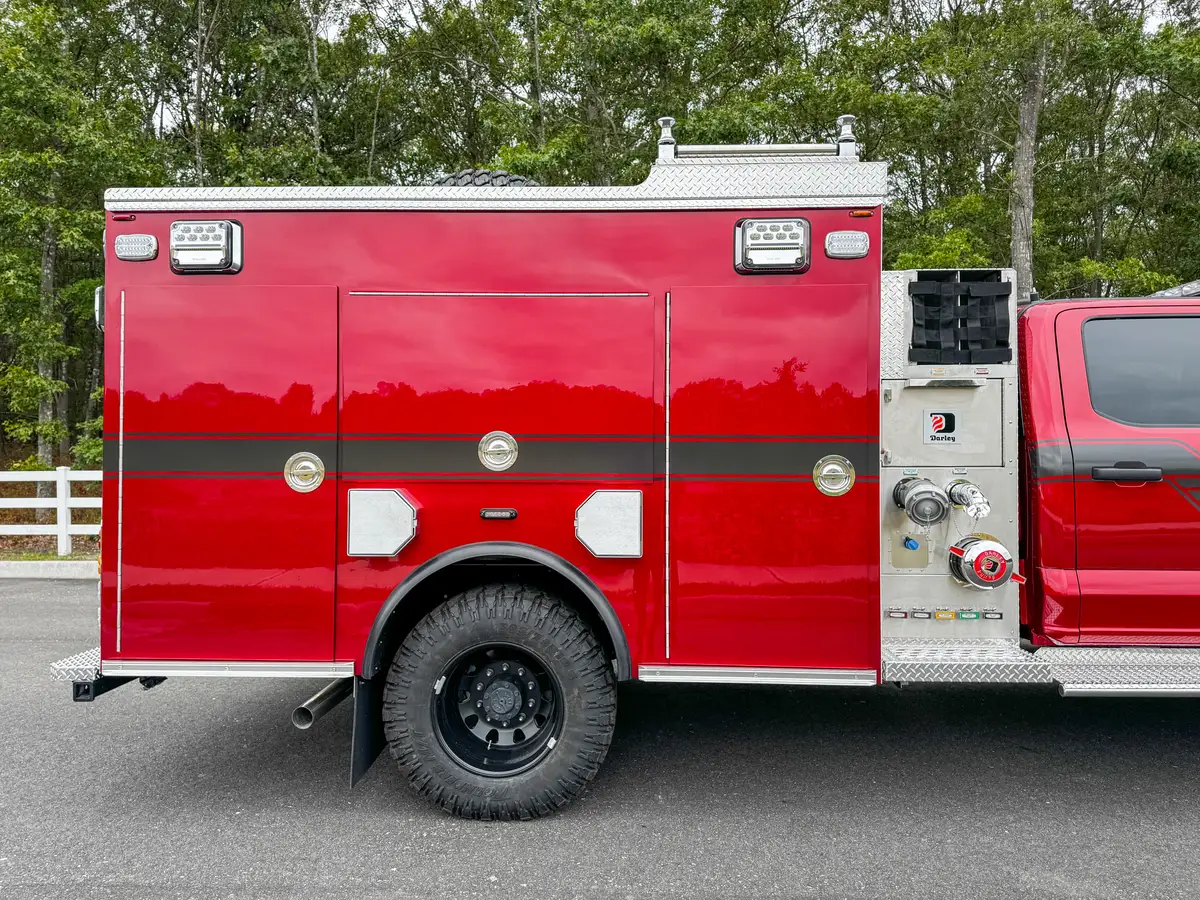 Open side compartment view with shelf and red compartment door.